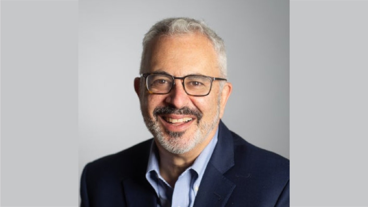 Josh Wyner, Executive Director of the Aspen Institute College Excellence Program, smiles at the camera while wearing glasses.