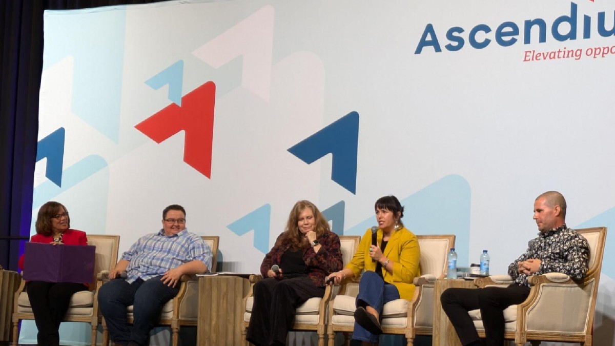 Five panelists are pictured on a stage sitting in chairs at an Ascendium-sponsored convening.